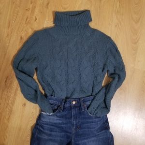 muted blue cable knit turtleneck sweater
